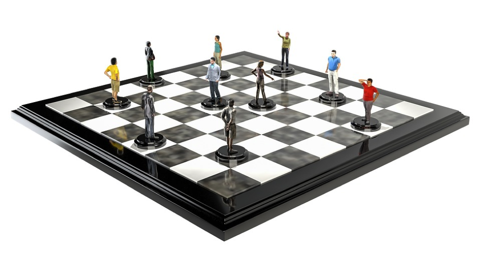 Chess board with people on depicting employment strategy