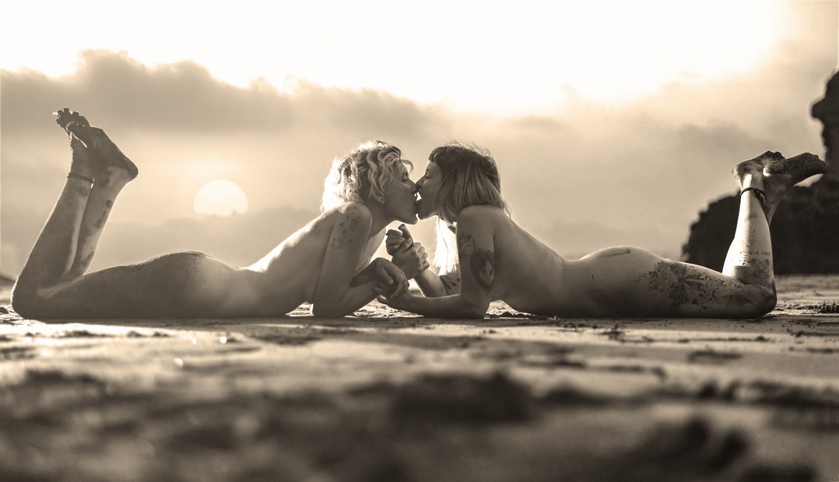 same sex marriage - lovely lesbians kissing on a beach